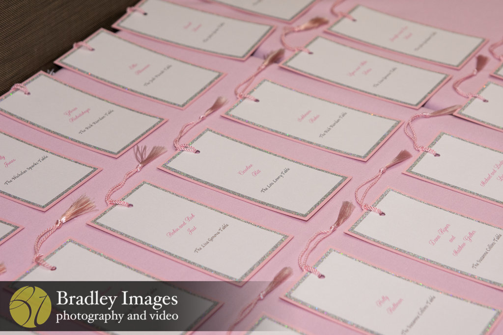 Bookmark escort cards at Lindsey's pink book themed Bat Mitzvah party at DoubleTree Bethesda | Pop Color Events | Adding a Pop of Color to Bar & Bat Mitzvahs in DC, MD & VA | Photo by Bradley Images