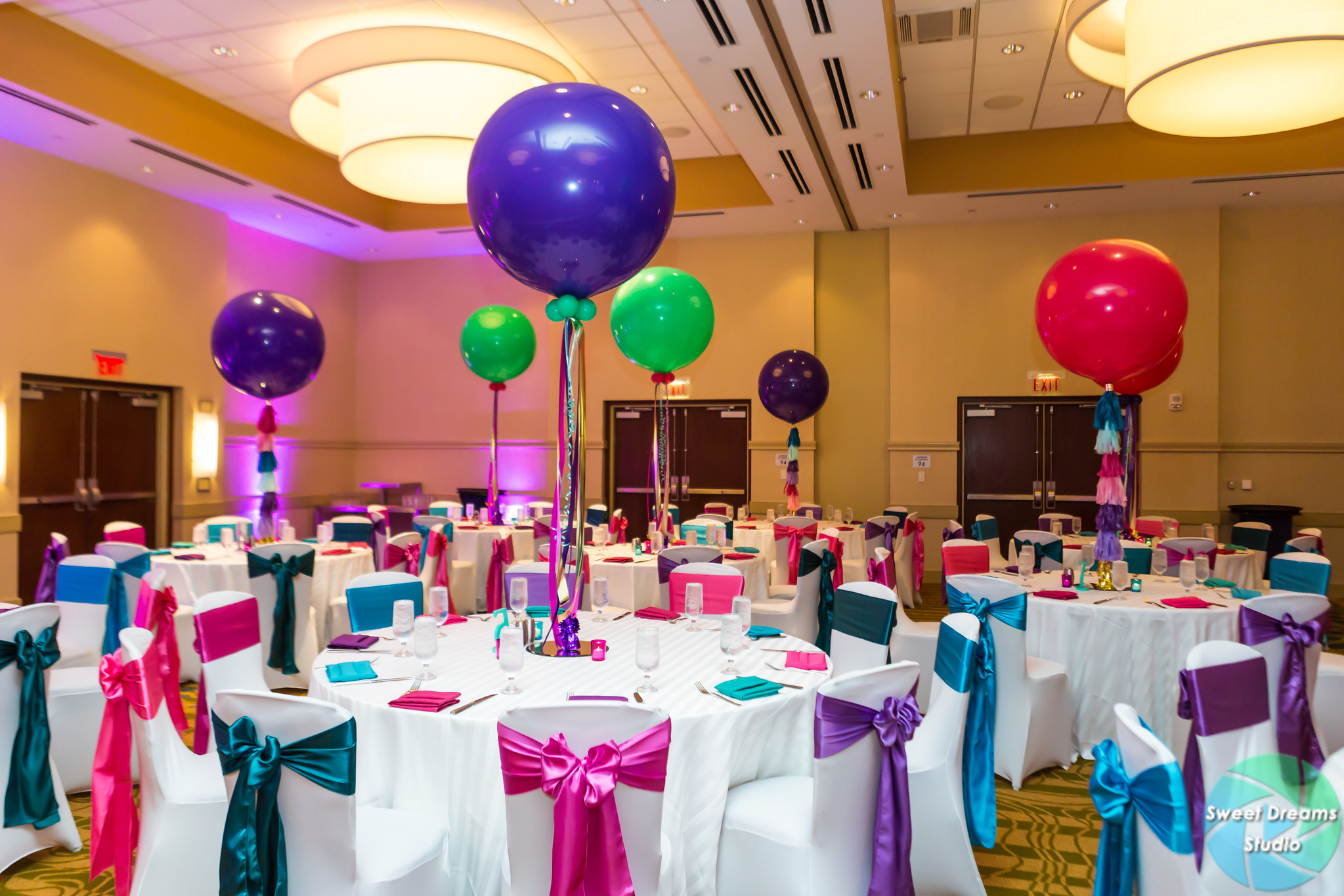 Liv it Up tassel balloon centerpieces at Olivia's colorful, jewel-toned, balloon-filled Bat Mitzvah party at Hyatt Regency Dulles. Pink, purple, teal, turquoise and gold. | Pop Color Events | Adding a pop of color to Bar & Bat Mitzvahs in DC, MD & VA | Photo by Sweet Dreams Studios