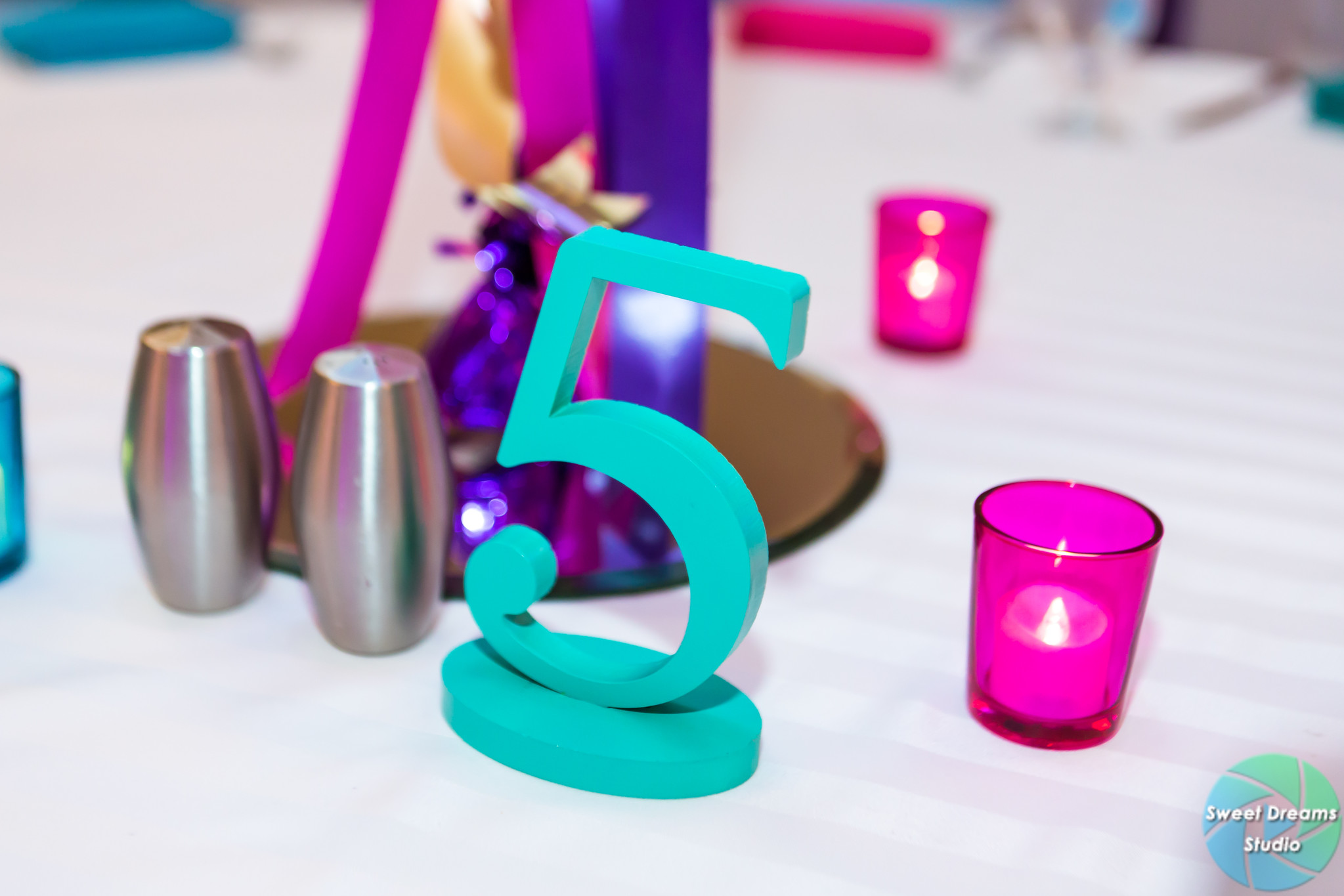 Liv it Up table number at Olivia's colorful, jewel-toned, balloon-filled Bat Mitzvah party at Hyatt Regency Dulles. Pink, purple, teal, turquoise and gold. | Pop Color Events | Adding a pop of color to Bar & Bat Mitzvahs in DC, MD & VA | Photo by Sweet Dreams Studios