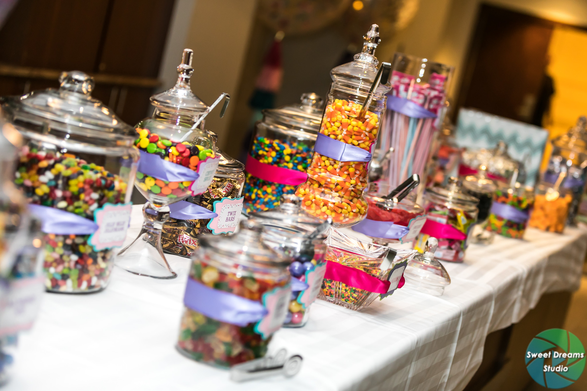 Liv it Up candy bar buffet at Olivia's colorful, jewel-toned, balloon-filled Bat Mitzvah party at Hyatt Regency Dulles. Pink, purple, teal, turquoise and gold. | Pop Color Events | Adding a pop of color to Bar & Bat Mitzvahs in DC, MD & VA | Photo by Sweet Dreams Studios