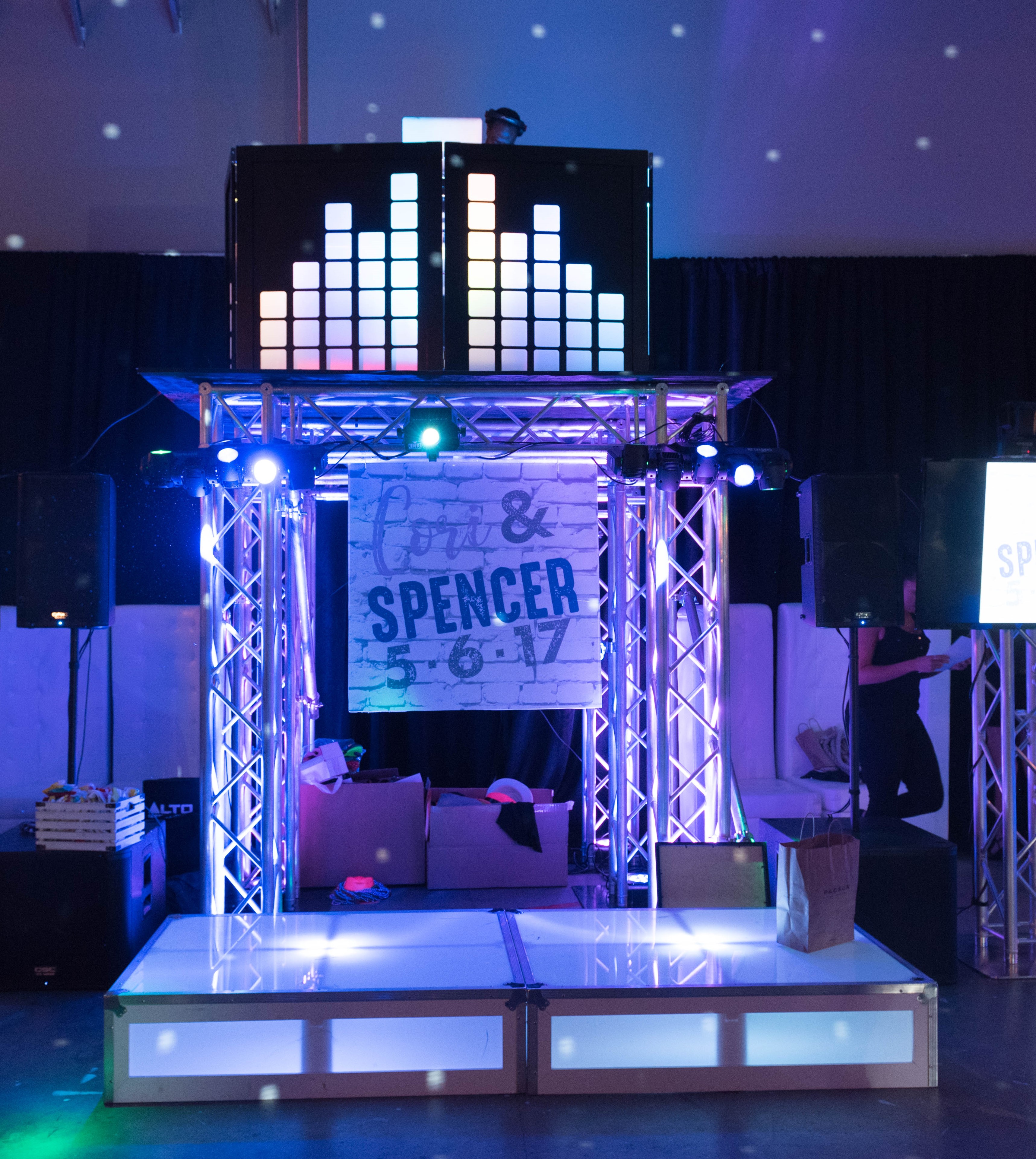 DJ booth at a midnight blue and lavender urban lounge and club-themed B'nai Mitzvah party for twins in Beltsville, Maryland | Pop Color Events | Adding a Pop of Color to Bar and Bat Mitzvahs in DC, MD & VA