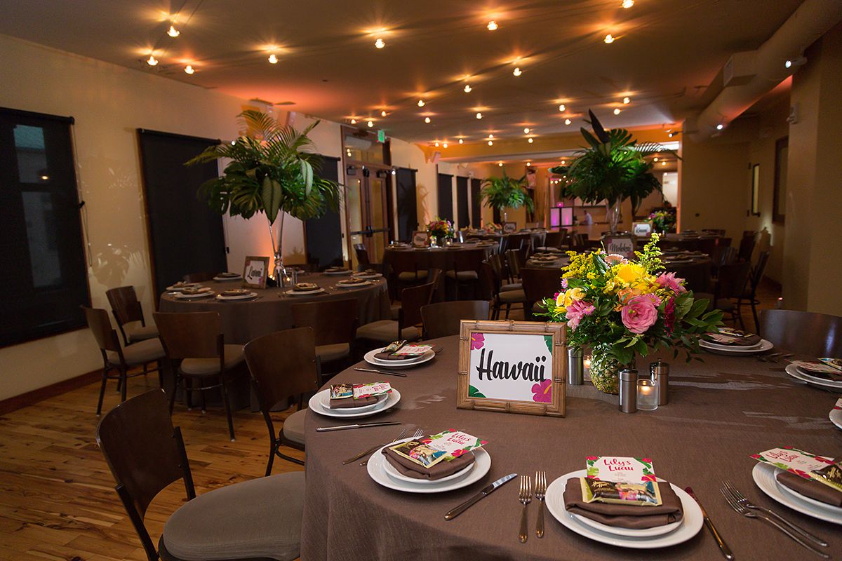 Tropical Flower and leaves centerpieces at Lily's Pinstripes Georgetown DC Luau Bat Mitzvah Party | Pop Color Events | Adding a pop of color to Bar & Bat Mitzvahs in DC, MD & VA | Photo by Powell Woulfe Photography