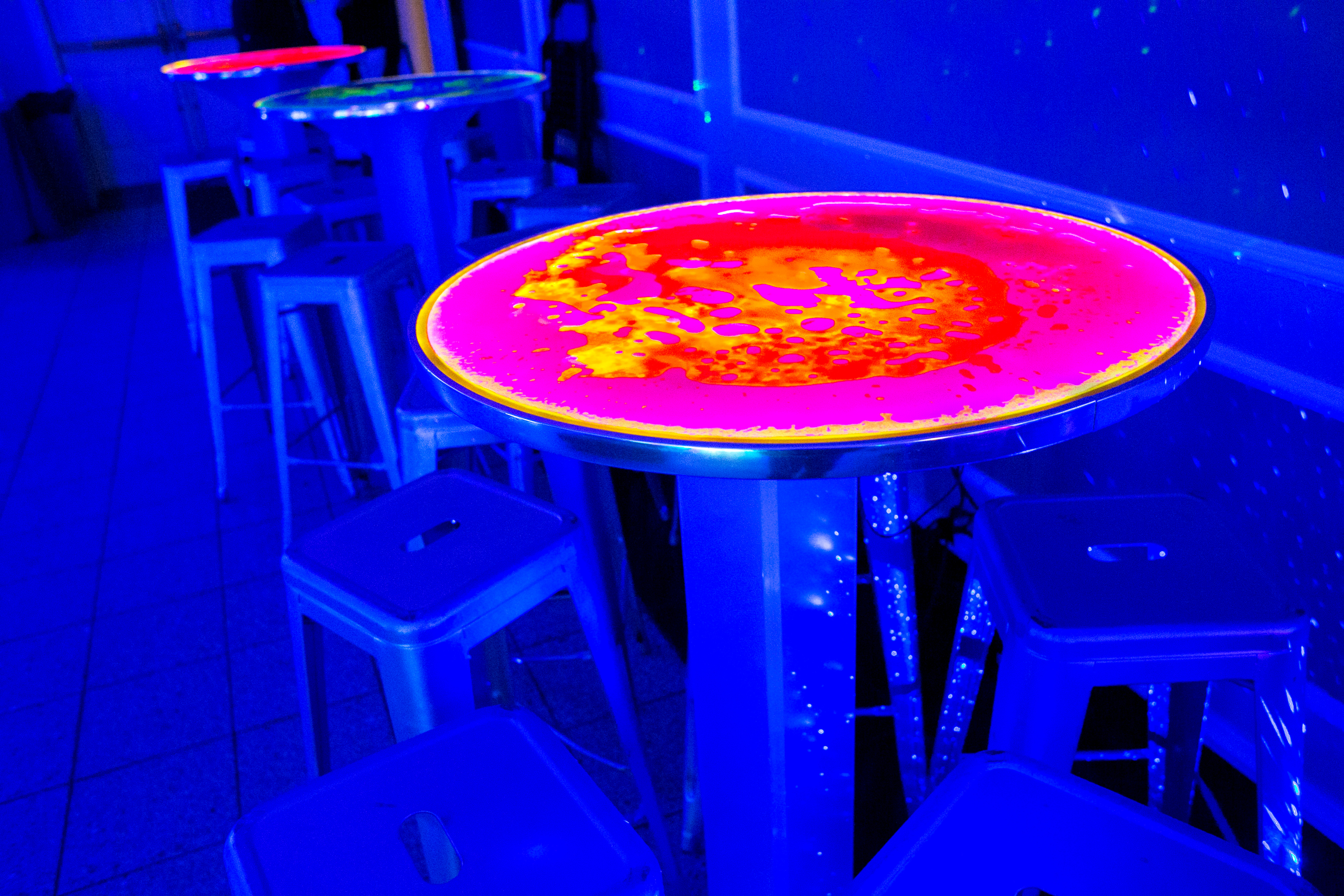 Glowing cocktail tables at Daniel's Outer Space Bar Mitzvah Party at Rock Creek Mansion in Bethesda, MD | Pop Color Events | Adding a Pop of Color to Bar & Bat Mitzvahs in DC, MD & VA | Photo Credit: Michael Temchine Photography