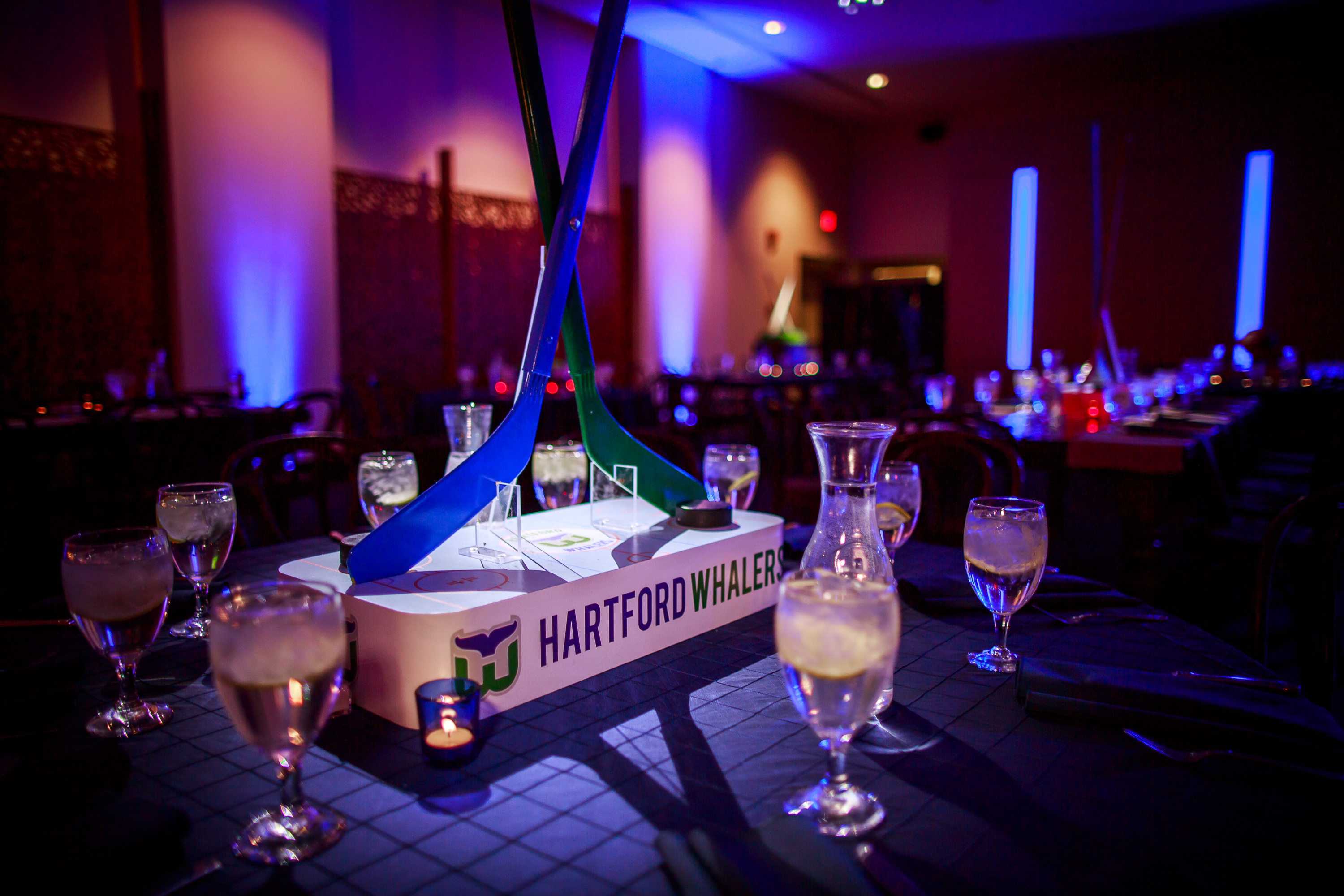 Hockey centerpiece at Vintage sports Bar Mitzvah party at Adas Israel in Washington DC | Pop Color Events | Adding a Pop of Color to Bar & Bat Mitzvahs in DC, MD & VA | Photo by Matt Mendelsohn Creative