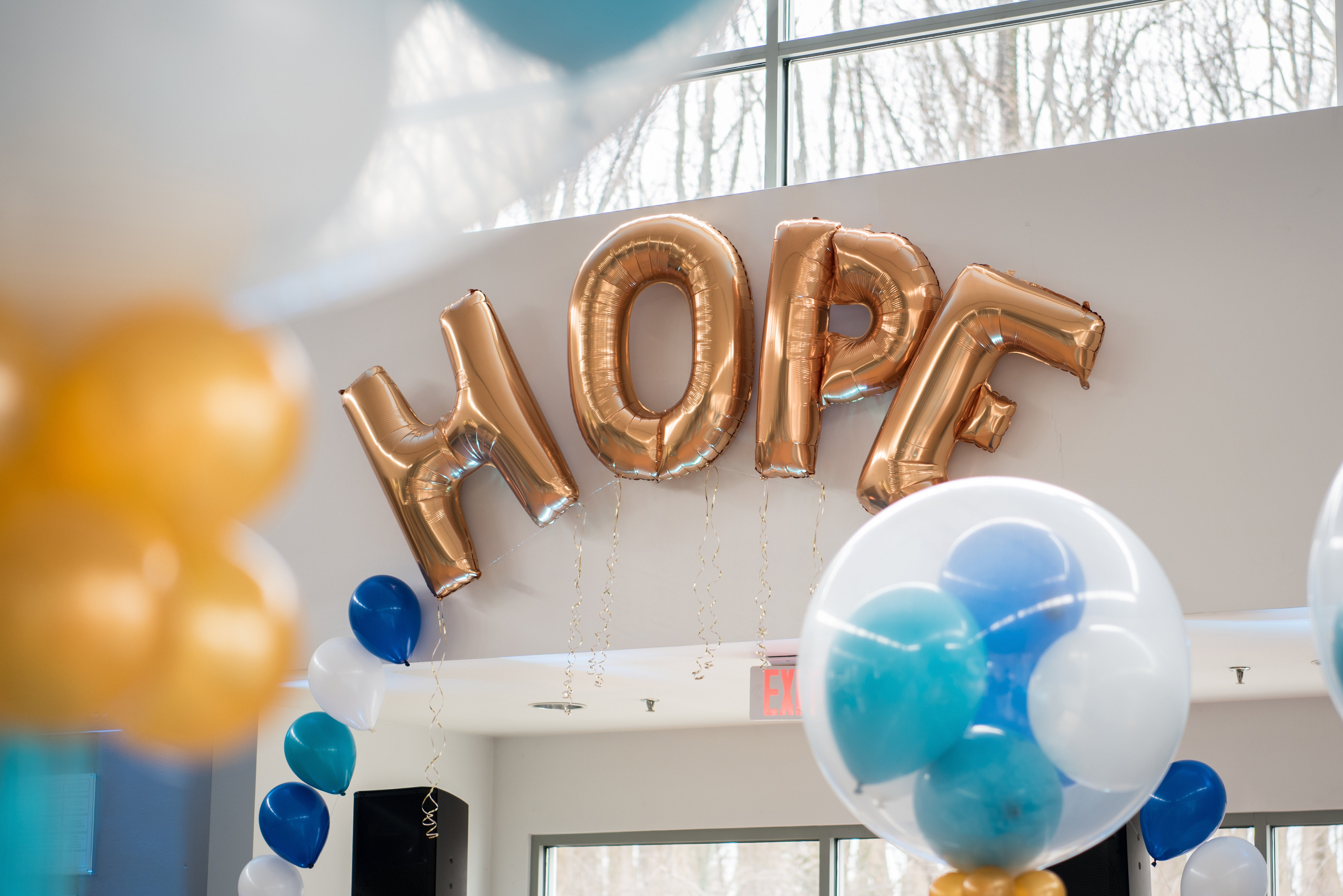 Balloon arch at Hope's teal and blue Bat Mitzvah party at Temple Rodef Shalom in Falls Church, Virginia with balloons, a mirror photo booth and chevron. | Pop Color Events | Adding a Pop of Color to Bar & Bat Mitzvahs in DC, MD & VA | Photo by Greg Land Photography