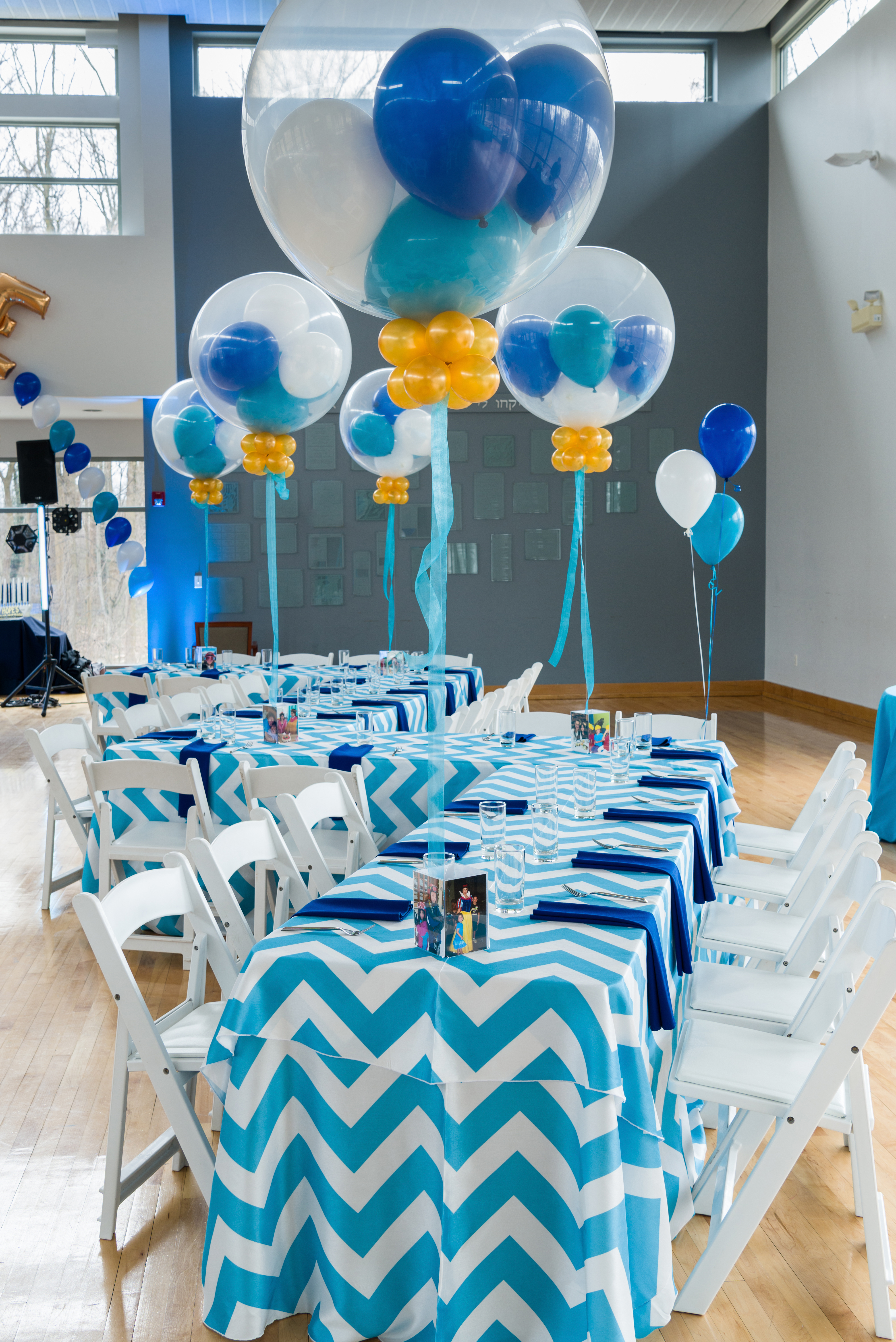 Hope's teal and blue Bat Mitzvah party at Temple Rodef Shalom in Falls Church, Virginia with balloons, a mirror photo booth and chevron. | Pop Color Events | Adding a Pop of Color to Bar & Bat Mitzvahs in DC, MD & VA | Photo by Greg Land Photography