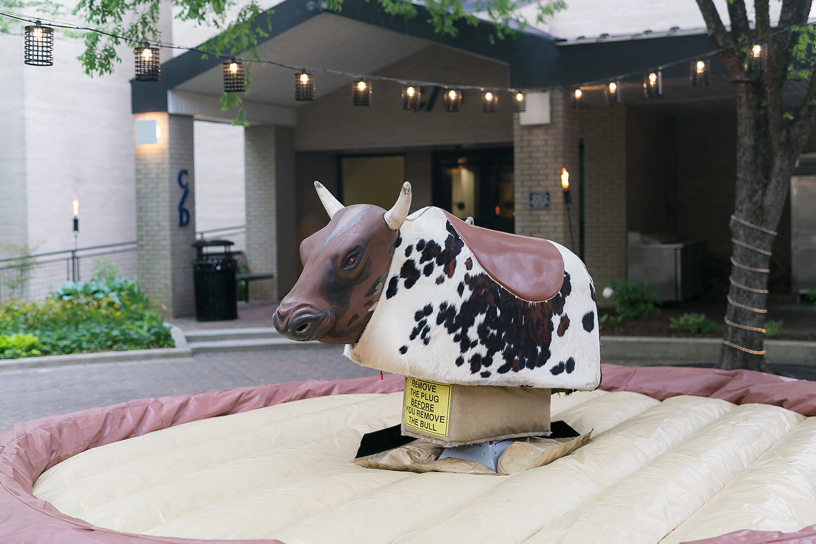 Mechanical bull at Michael's Western-themed Bar Mitzvah Party at Bolger Center Pony Express Room in Potomac, MD | Pop Color Events | Adding a Pop of Color to Bar and Bat Mitzvahs in DC, MD and VA | Photo by Powell Woulfe Photography
