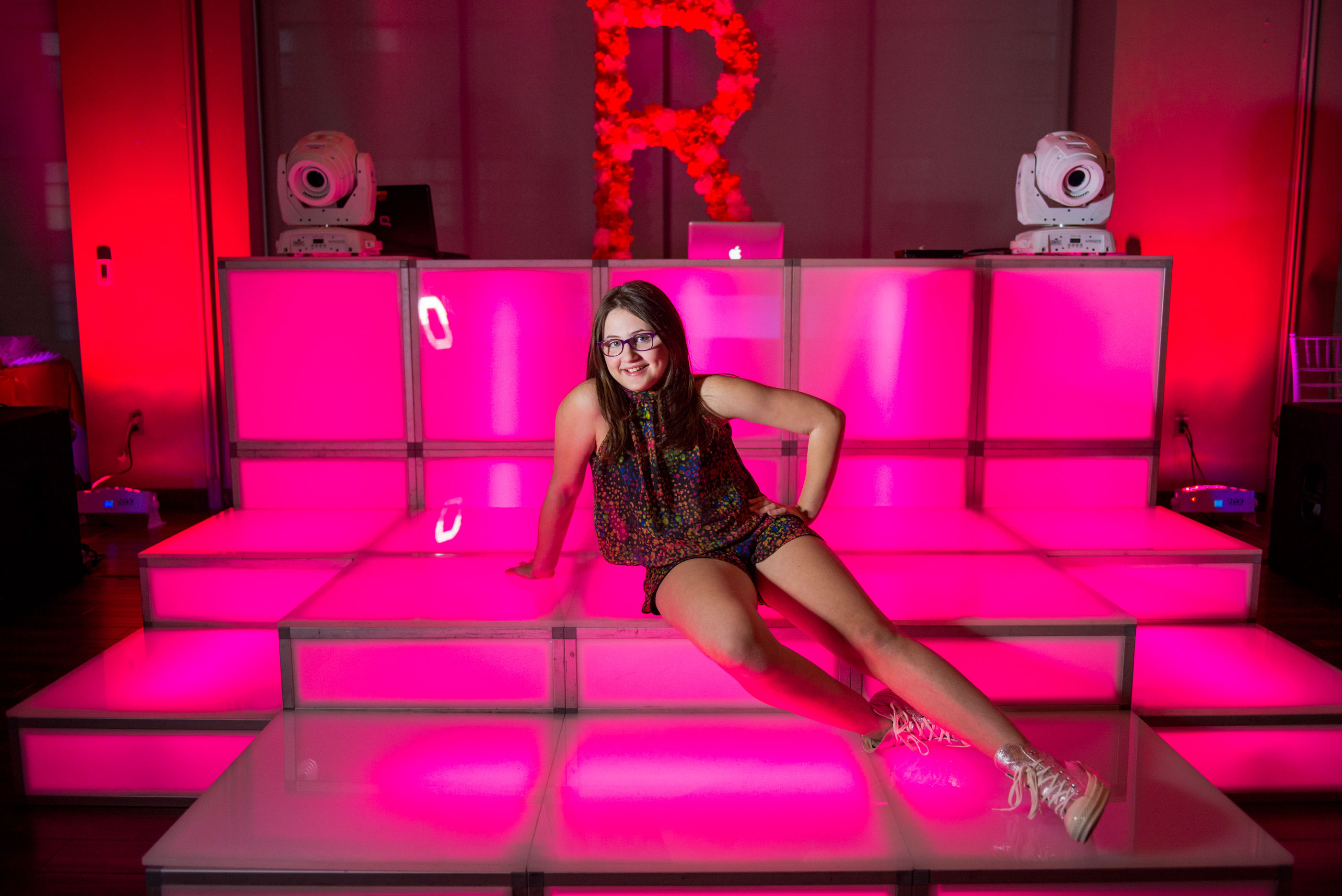 Paper Flower "R" backdrop at Reisa's colorful pink and orange Bat Mitzvah at Pinstripes Pike and Rose Bethesda | Pop Color Events | Adding a Pop of Color to Bar & Bat Mitzvahs in DC, MD & VA | Photo by Bradley Images