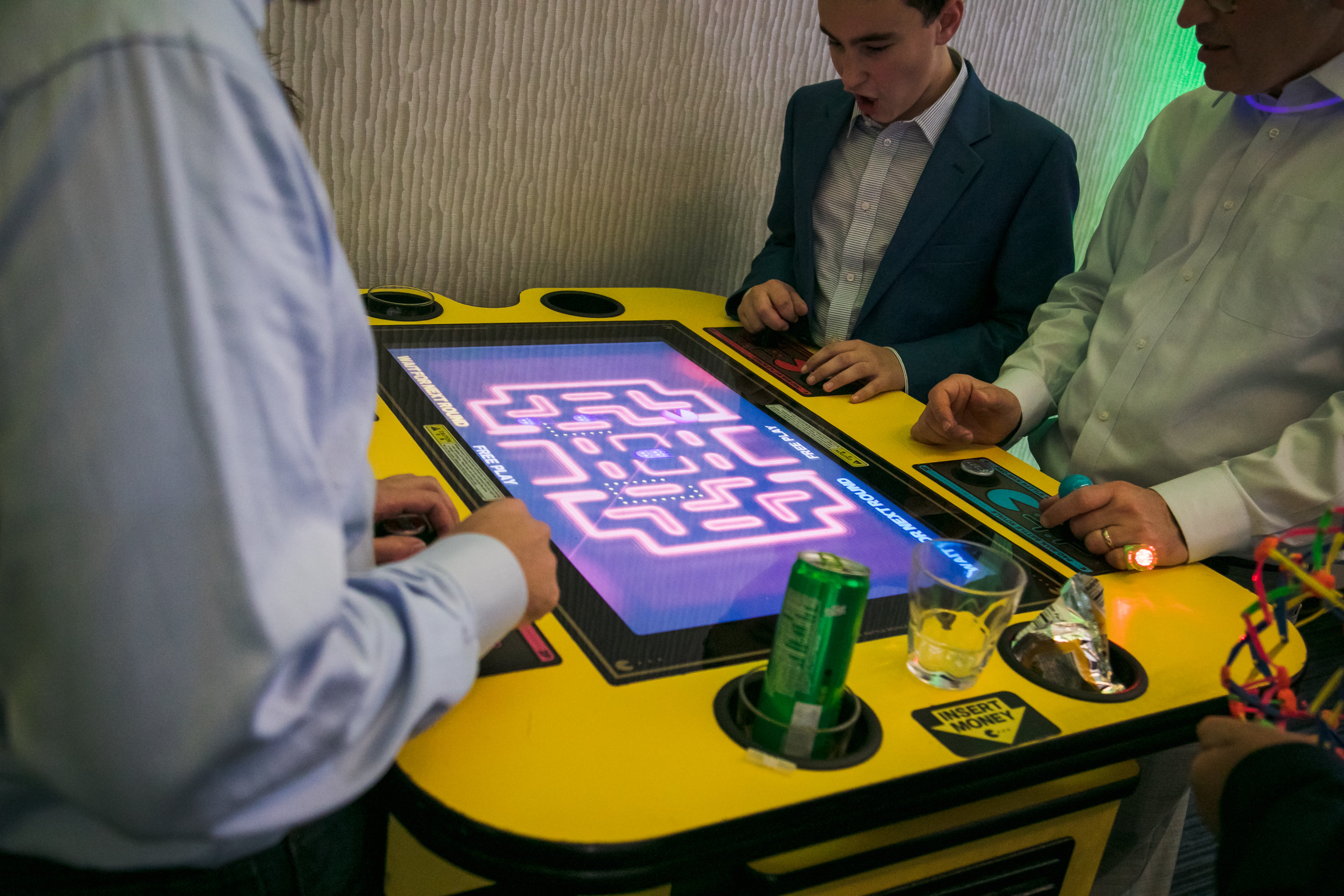 Video games at James's Games-themed Bar Mitzvah party at Hyatt Regency Tysons Corner with balloons, arcade games and playing cards in Northern Virginia. | Pop Color Events | Adding a Pop of Color to Bar & Bat Mitzvahs in DC, MD & VA | Photo by Bradley Images