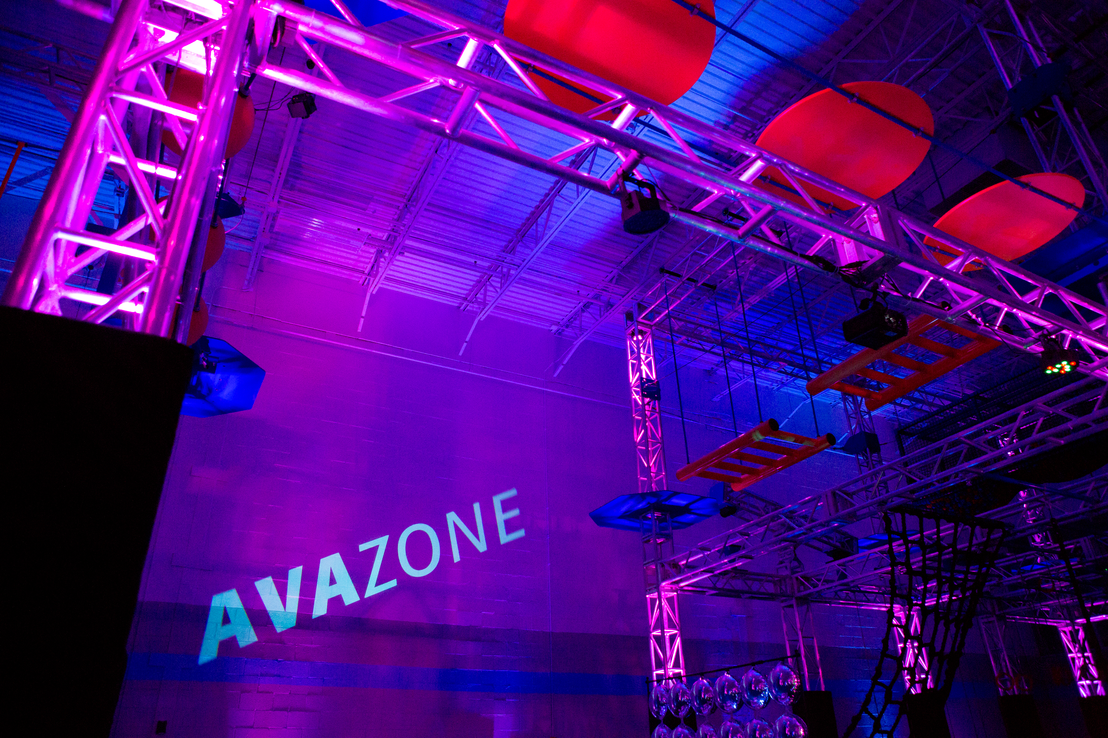 Gobo Lighting at the AvaZone | Ava with a giant, 12' bear | AvaZone Magical Whimsical Fantasy themed Bat Mitzvah party with bears, lighting, lounge furniture, cotton candy, unicorn tables and more at ZavaZone in Sterling VA | Photography by Jessica Latos Photography