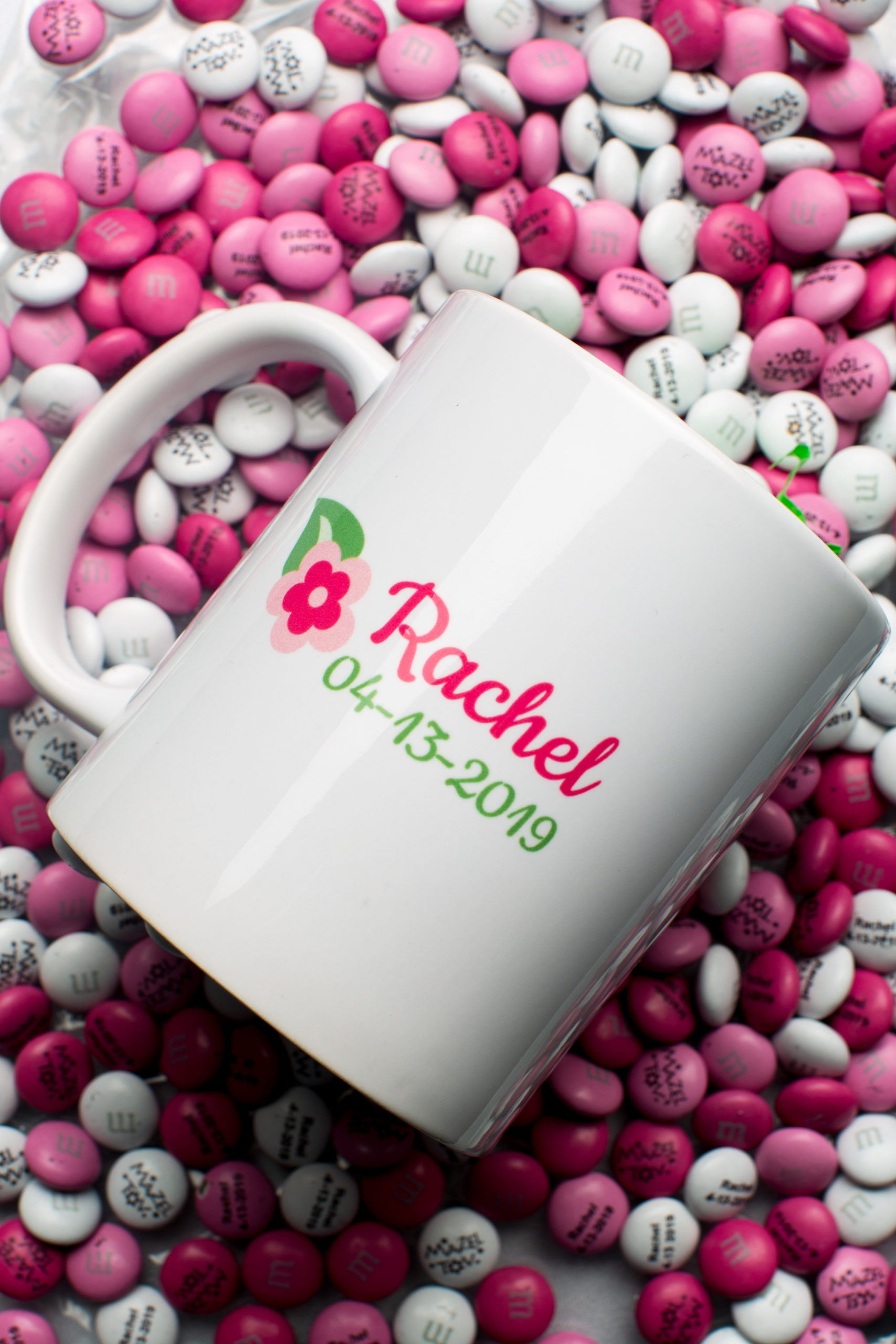 Coffee mug favors with M&Ms at Rachel's Cherry Blossom Bat Mitzvah at Agudas Achim in Alexandria, VA | Pop Color Events | Adding a Pop of Color to Bar & Bat Mitzvahs in DC, MD & VA | Photo by: Mitzvahs by Michael Temchine