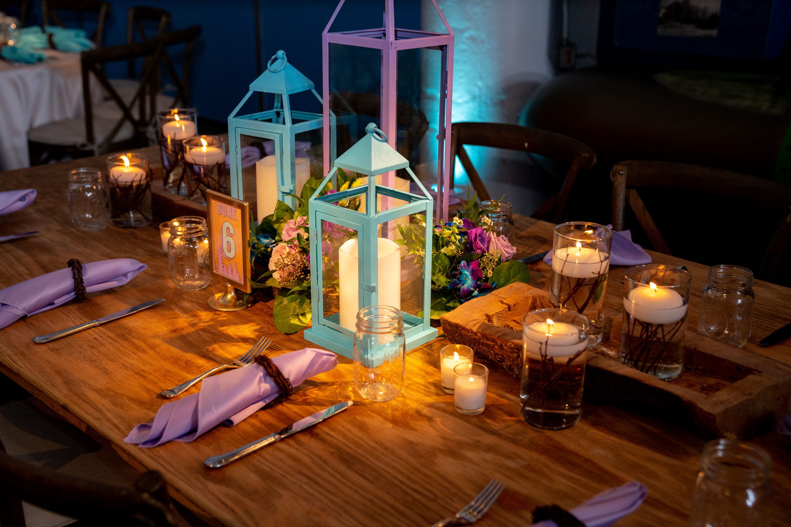 Centerpieces and tables at Sydney’s Rustic Summer Camp themed Bat Mitzvah party at the Torpedo Factory, Alexandria, VA | Pop Color Events | Adding a Pop of Color to Bar & Bat Mitzvahs in DC, MD & VA | Photo by: Michael Temchine Photography