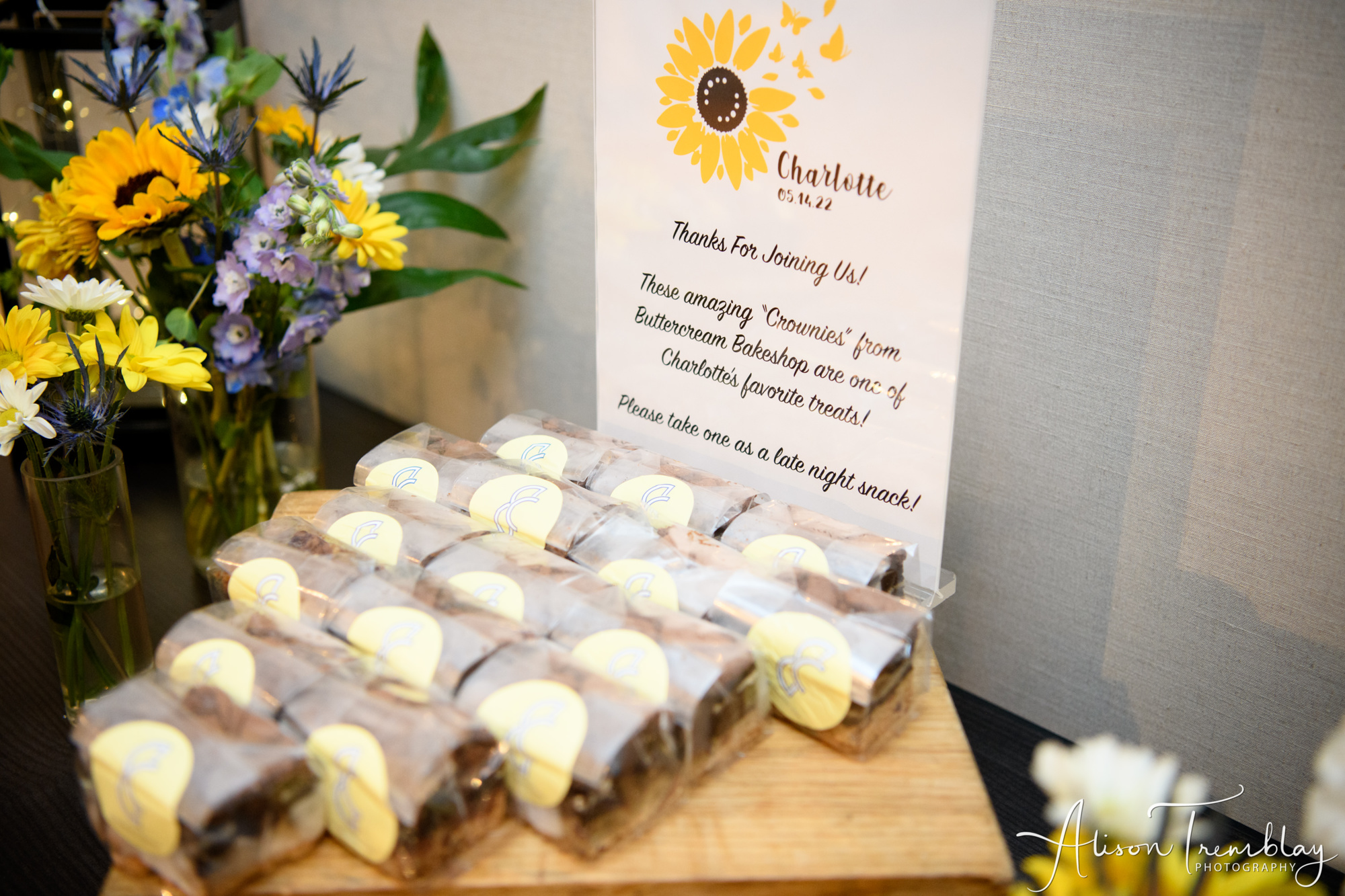 Charlotte's give aways with beautiful decor of flowers at Charlotte's Sunflower and Butterfly Bat Mitzvah Party at Eaton In Washington, DC | Pop Color Events | Adding a Pop of Color to Bar & Bat Mitzvahs in DC, MD & VA | Photo by: Alison Tremblay