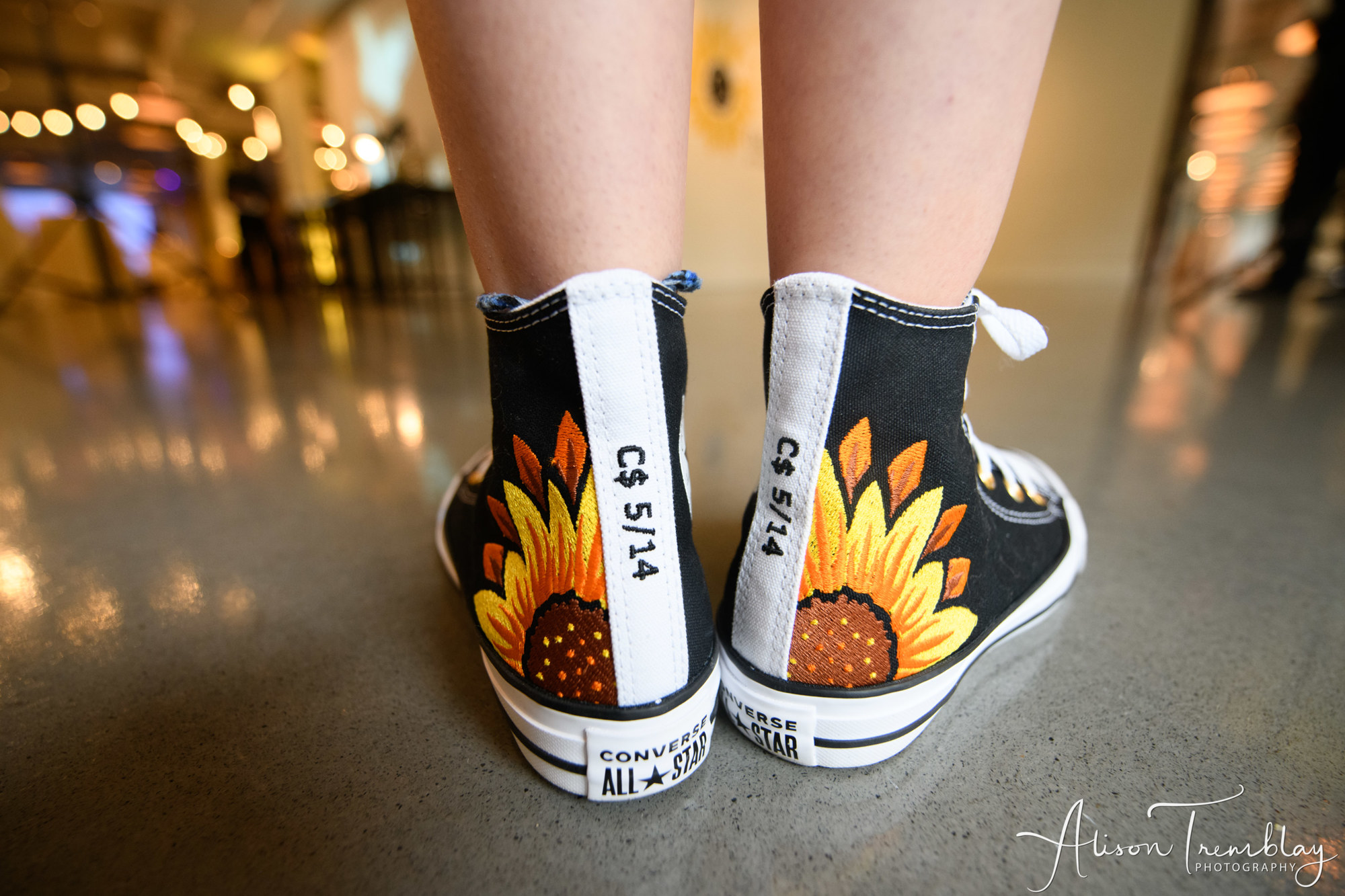 Charlotte's custom black Converse sneakers with sunflower details including her nickname and Bat Mitzvah date at Charlotte's Sunflower and Butterfly Bat Mitzvah Party at Eaton in Washington, DC | Pop Color Events | Adding a Pop of Color to Bar & Bat Mitzvahs in DC, MD & VA | Photo by: Alison Tremblay