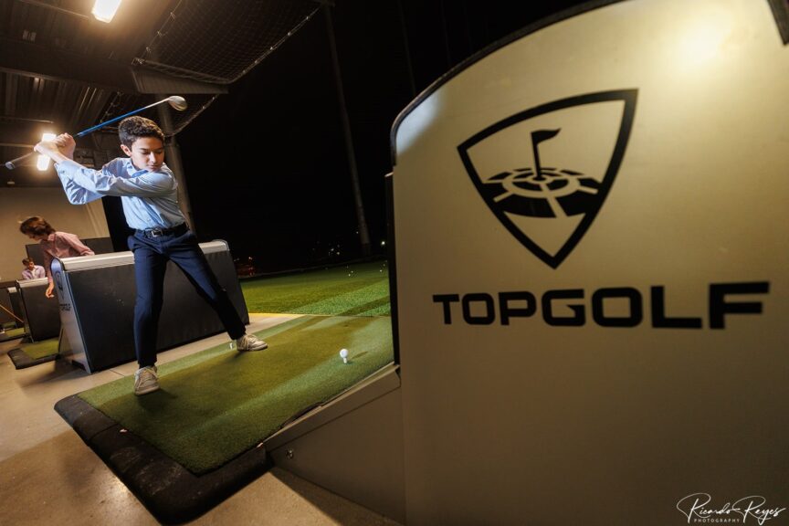 Max golfing at Max's Sporty Bar Mitzvah Party at Top Golf in Germantown, MD | Pop Color Events | Adding a Pop of Color to Bar & Bat Mitzvahs in DC, MD & VA | Photo by: Ricardo Reyes Photography