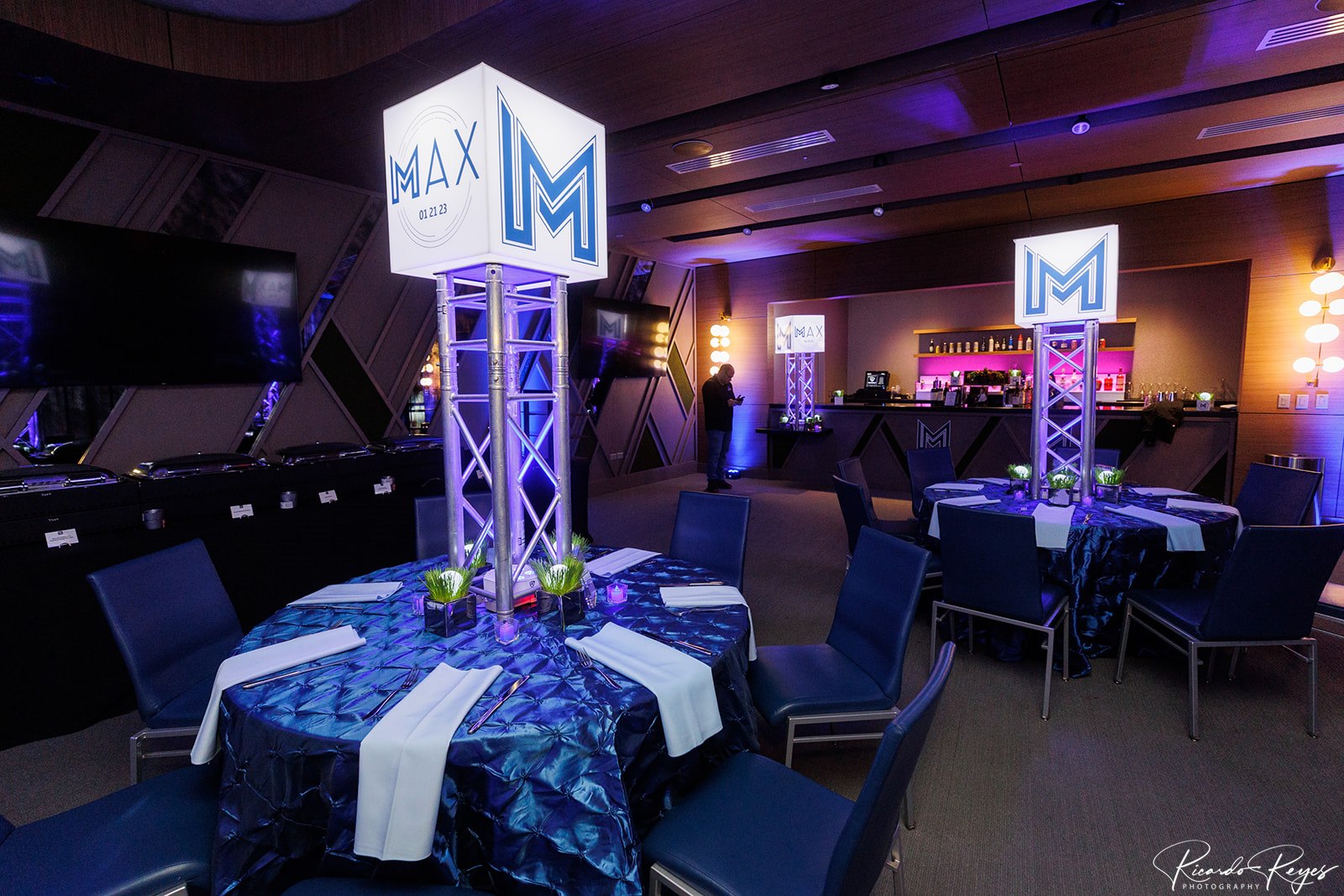 Max's reception with blue and white colors with his logo at Max's Sporty Bar Mitzvah Party at Top Golf in Germantown, MD | Pop Color Events | Adding a Pop of Color to Bar & Bat Mitzvahs in DC, MD & VA | Photo by: Ricardo Reyes
