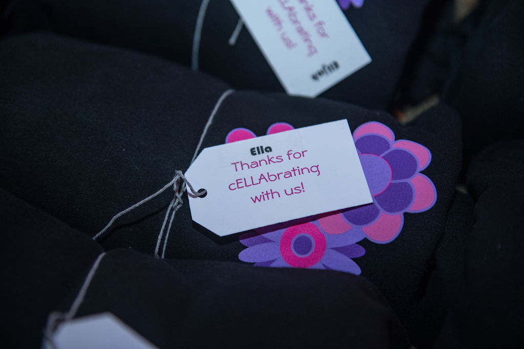 Sweatshirts with the colorful flower power design at Ella Chella Coachella-inspired Bat Mitzvah Party at AMP in Bethesda, MD | Pop Color Events | Adding a Pop of Color to Bar & Bat Mitzvahs in DC, MD & VA | Photo by: Fillman Photo