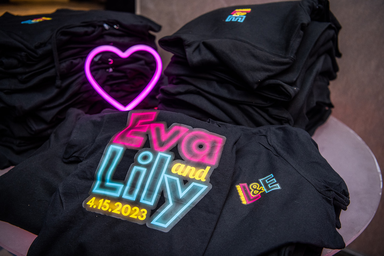 Logo Sweatshirts at Eva and Lily's Glowing Bat Mitzvah Party at the Bethesdan Hotel | Pop Color Events | Adding a Pop of Color to Bar & Bat Mitzvahs in DC, MD & VA | Photo by: Ana Isabel Photography