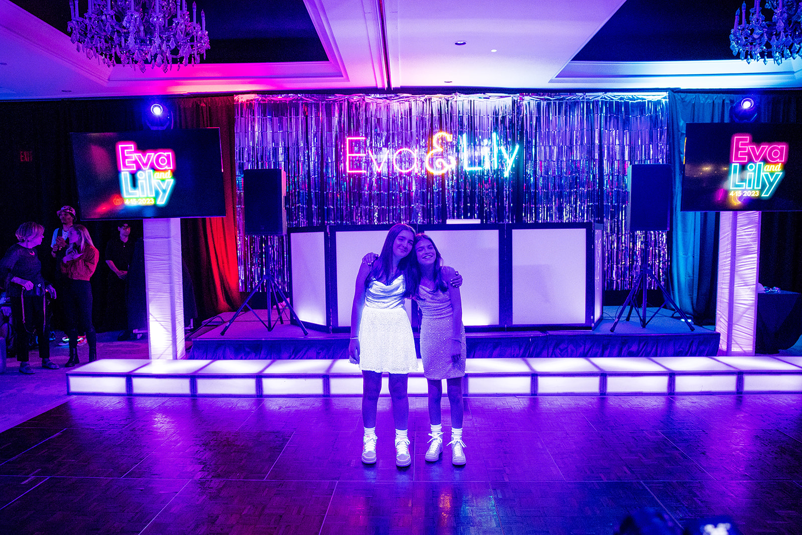 Blacklight and dance floor backdrop at Eva and Lily's Glowing Bat Mitzvah Party at the Bethesdan Hotel | Pop Color Events | Adding a Pop of Color to Bar & Bat Mitzvahs in DC, MD & VA | Photo by: Ana Isabel Photography