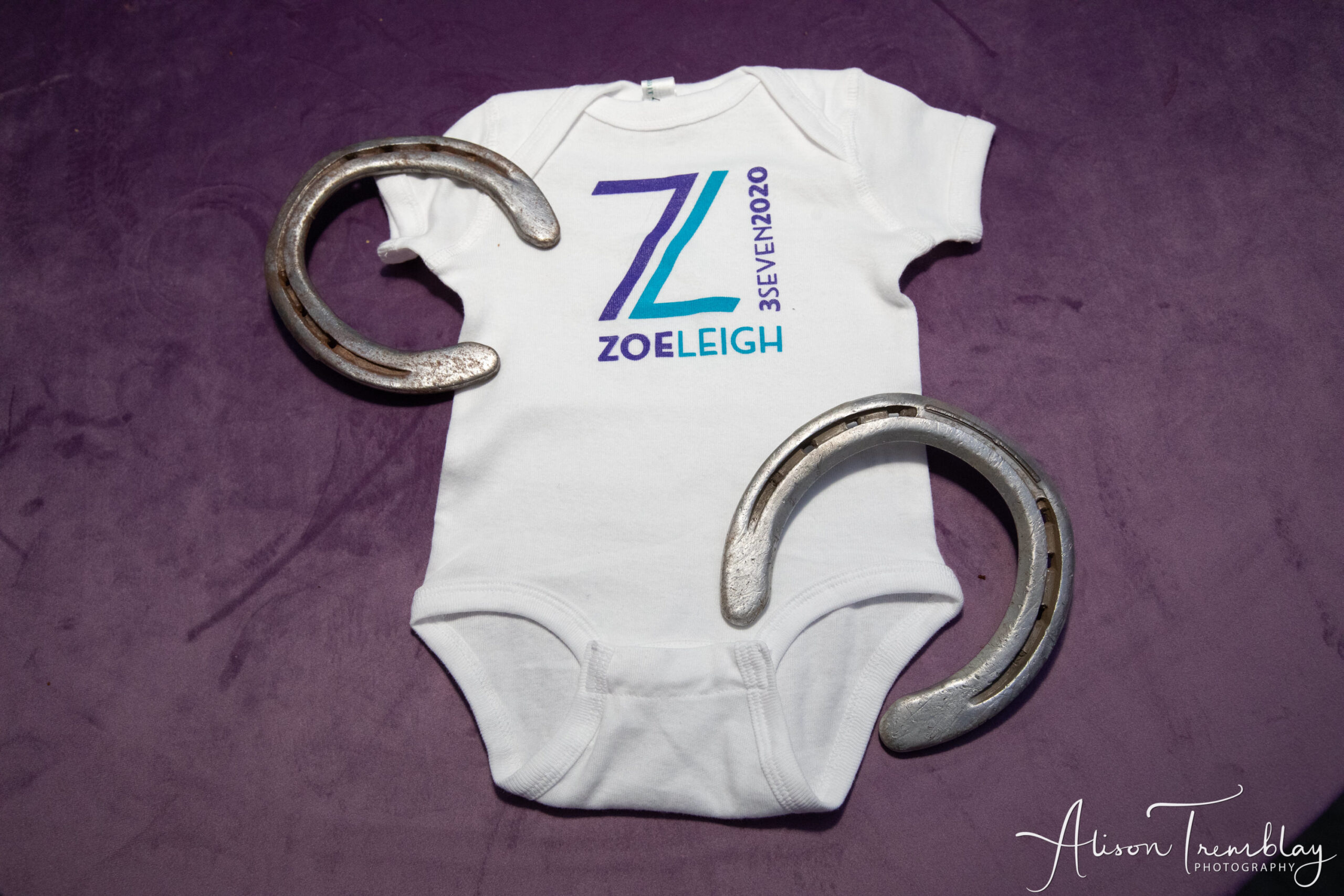 Onesie at Zoe's Purple and Teal Equestrian Bat Mitzvah at Canopy by Hilton Washington DC Bethesda North | Pop Color Events | Adding a Pop of Color to Bar & Bat Mitzvahs in DC, MD & VA | Photo by: Alison Tremblay Photography