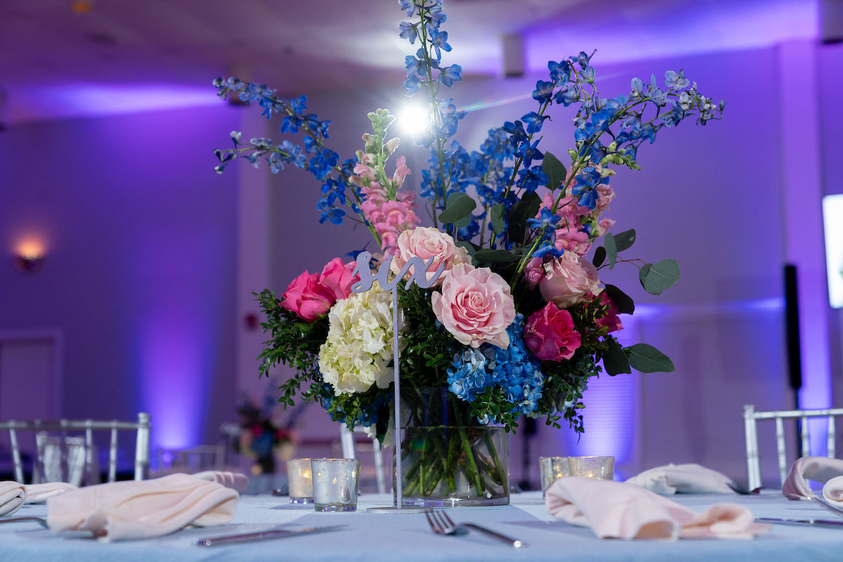 Floral centerpieces at Juliana's Floral Bat Mitzvah Party at Agudas Achim in Alexandria, VA | Pop Color Events | Adding a Pop of Color to Bar & Bat Mitzvahs in DC, MD & VA | Photo by: Michael Temchine Photography
