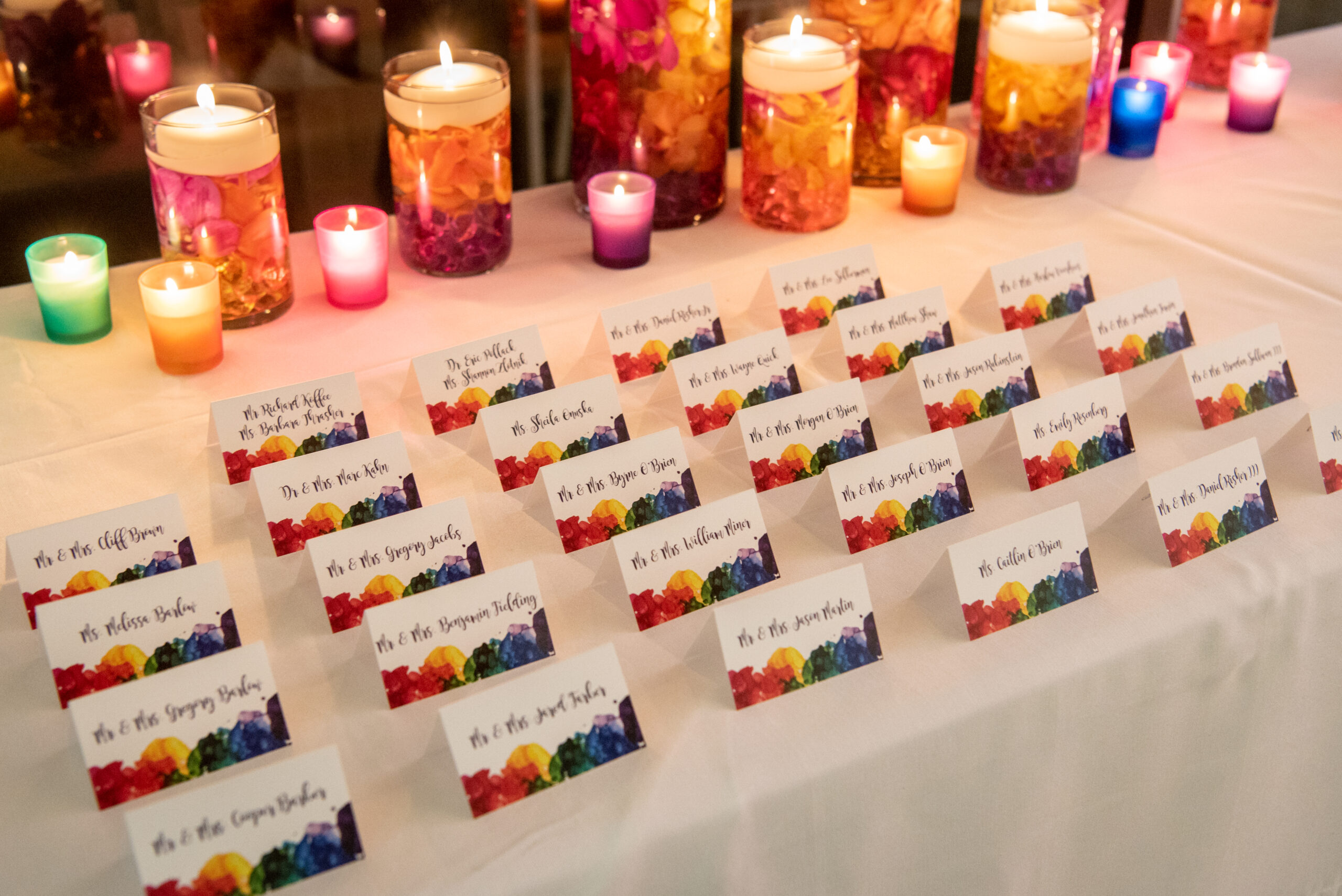 Escort cards at Hanna's colorful rainbow paper lantern Bat Mitzvah at VisArts | Pop Color Events | Adding a Pop of Color to Bar & Bat Mitzvahs in DC, MD & VA | Photo by: Greg Land