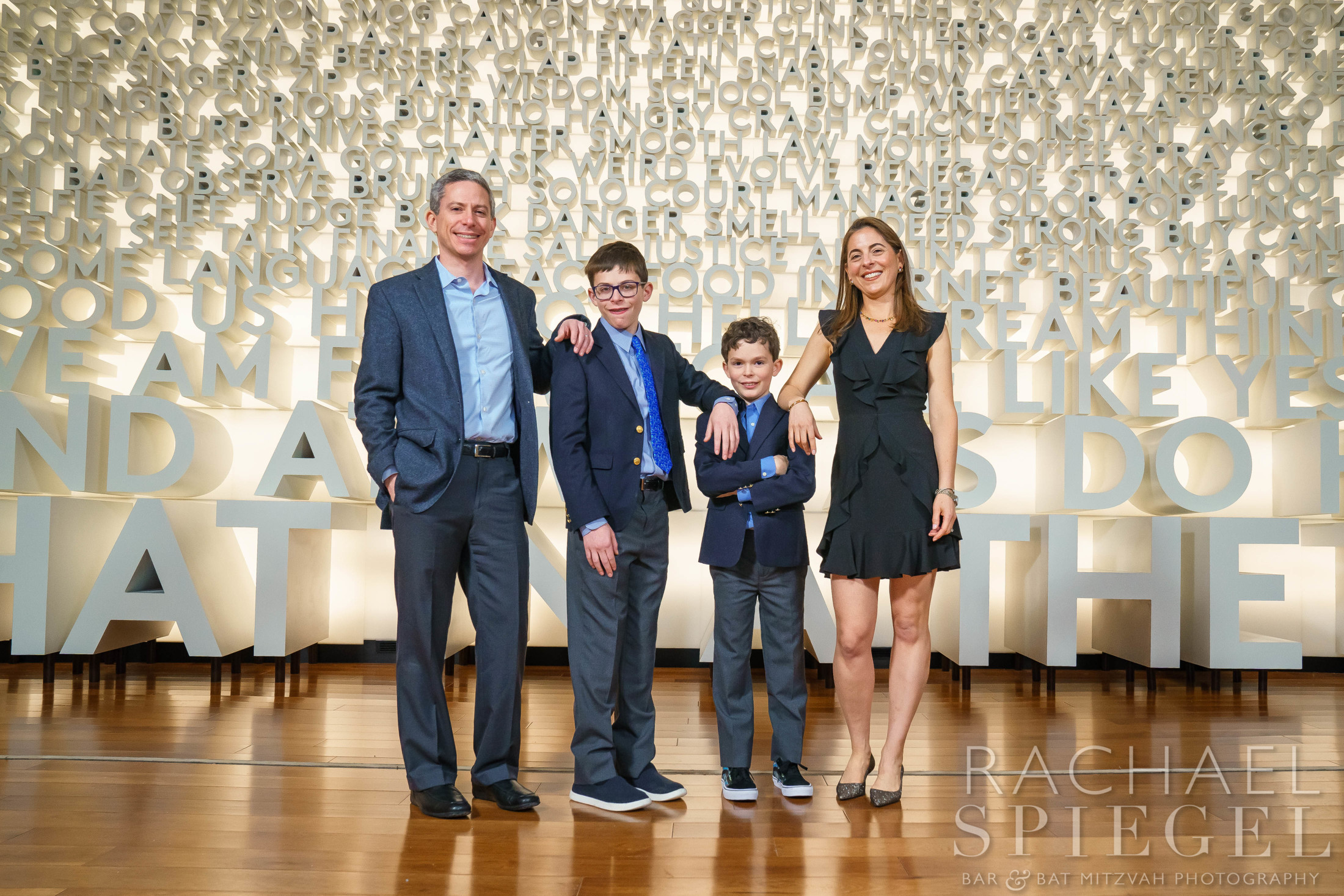 Family photos at the Word Wall at Planet Word In DC | Pop Color Events | Adding a Pop of Color to Bar & Bat Mitzvahs in DC, MD & VA | Photo by: Scavenger Hunts and maps at Jacob's Library Bar Mitzvah Party at Planet Word in DC | Pop Color Events | Adding a Pop of Color to Bar & Bat Mitzvahs in DC, MD & VA | Photo by: Rachael Spiegel