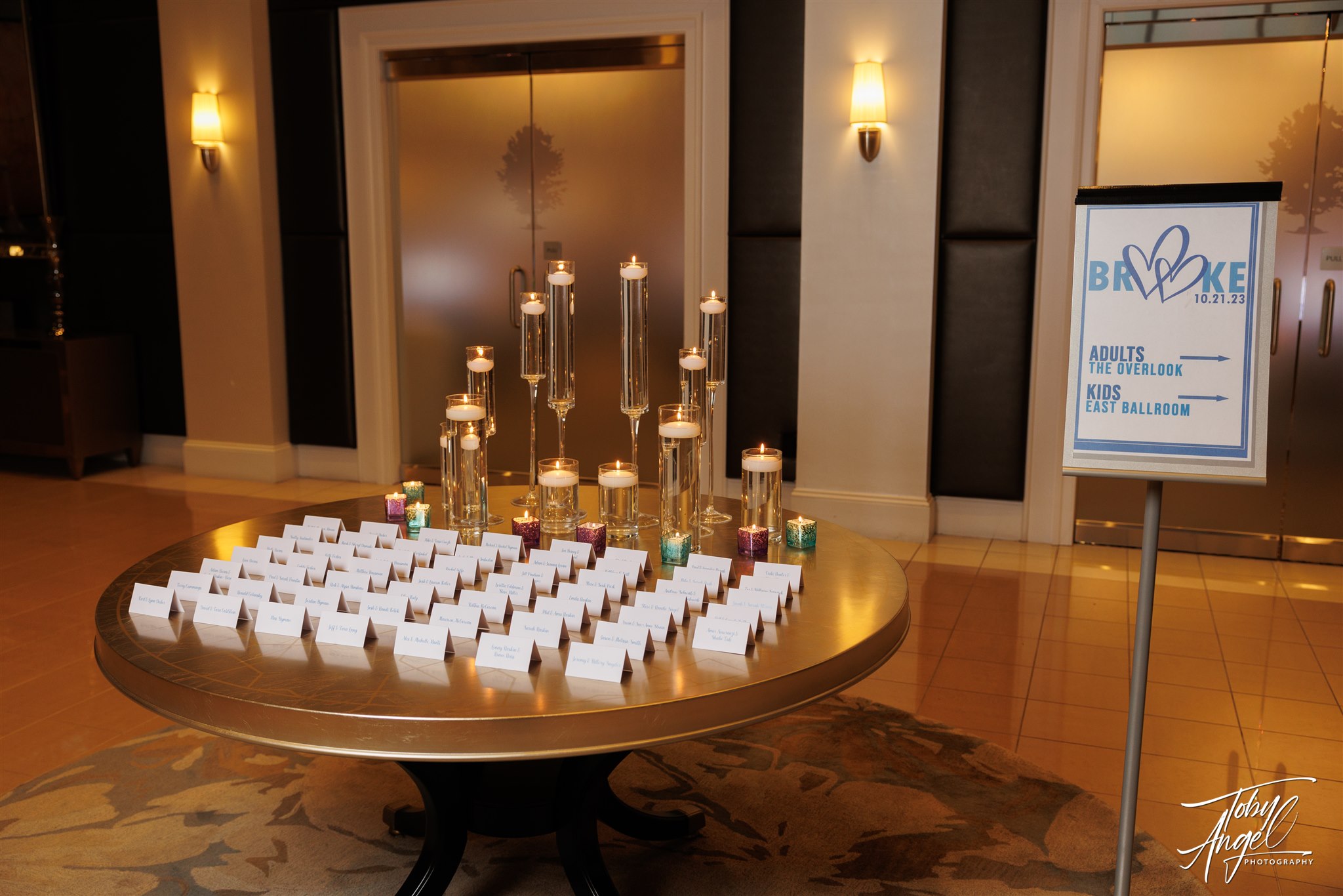 Escort Card table and directional signs at Brooke's Heart Filled Bat Mitzvah Party at Lakewood Country Club | Pop Color Events | Adding a Pop of Color to Bar & Bat Mitzvahs in DC, MD & VA | Photo by: Toby Angel Photography