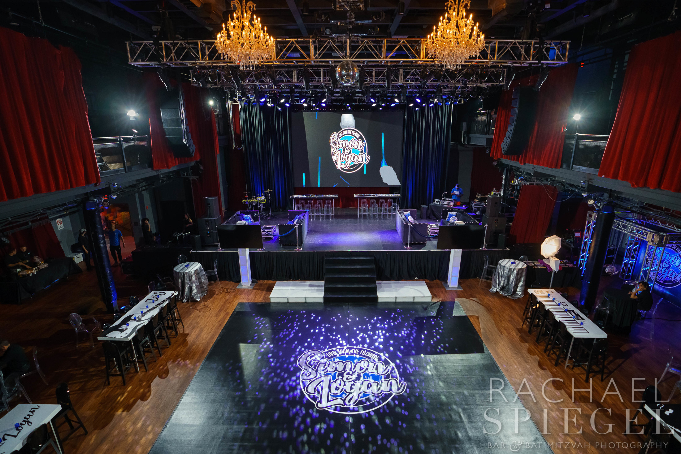 Video wall, dance floor  and lounge at Logan and Simon's Rock and Roll Bar Mitzvah at Fillmore Silver Spring | Pop Color Events | Adding a Pop of Color to Bar & Bat Mitzvahs in DC, MD & VA | Photo by: Rachael Spiegel Photography