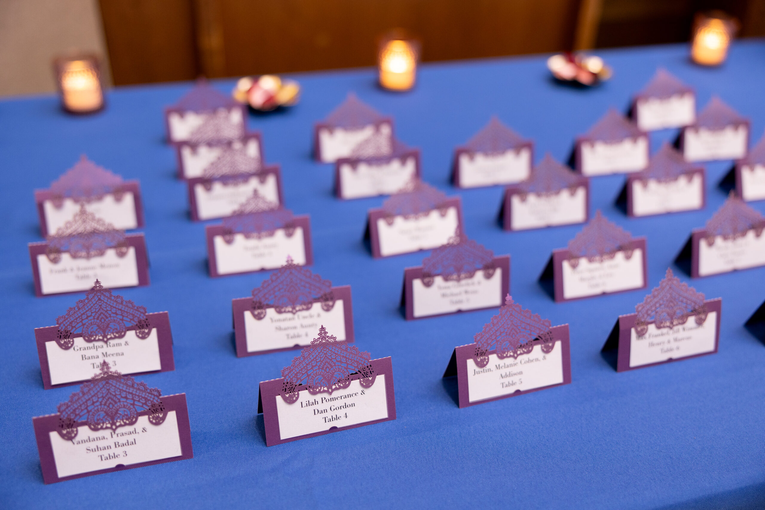 Mendhi escort cards with urli accents at Priya's Colorful Indian Fusion Bat Mitzvah Party at Silver Spring Civic Building | Pop Color Events | Adding a Pop of Color to Bar & Bat Mitzvahs in DC, MD & VA | Photo by: Jessica Latos Photography