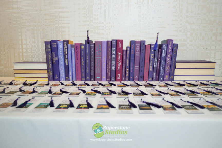Bookmark seating cards at Sarah's purple Books and Balloons Bat Mitzvah at Westin Arlington Gateway | Pop Color Events | Adding a Pop of Color to Bar & Bat Mitzvahs in DC, MD & VA | Photo by: Saperstone Studios